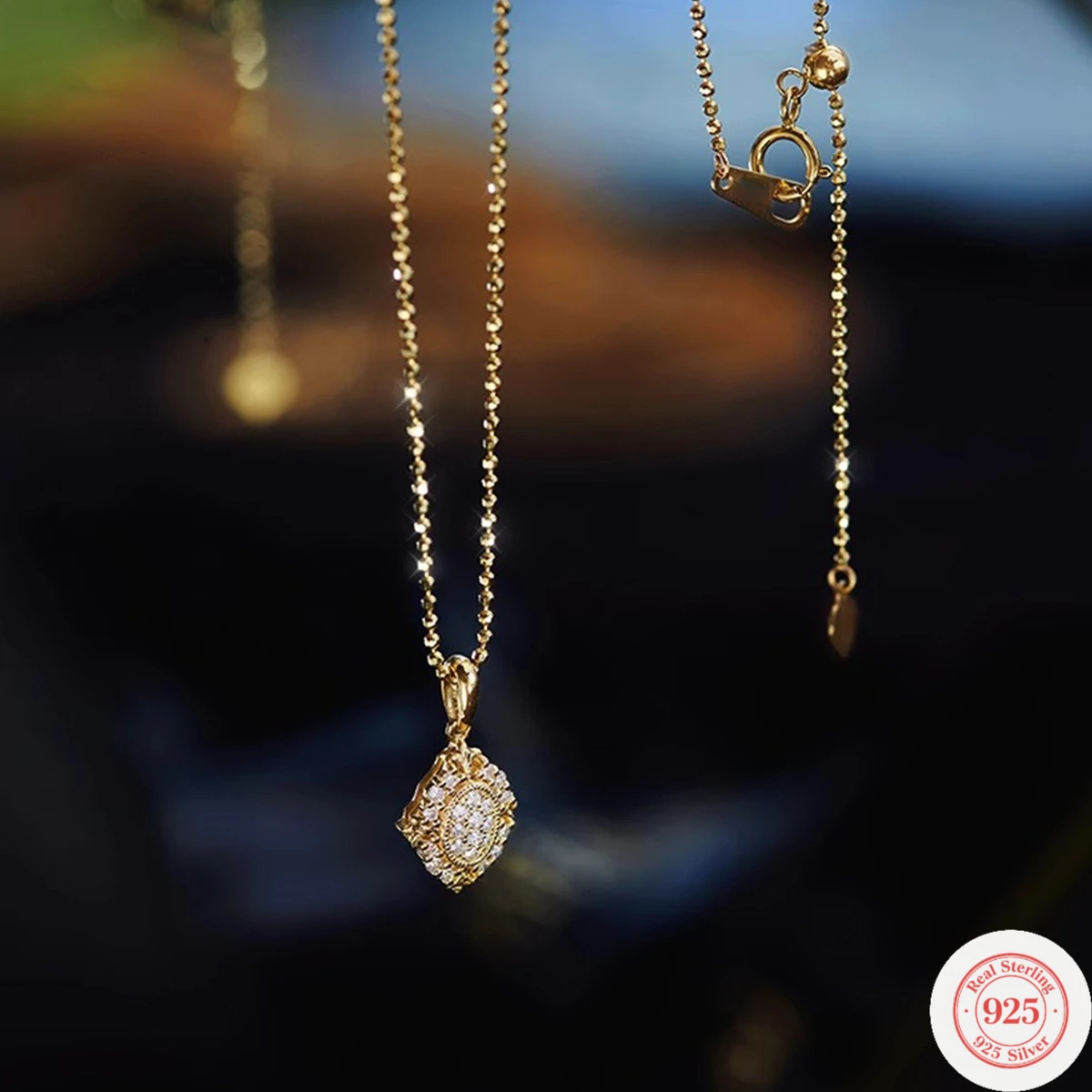 

S925 sterling silver women's necklace with a built-in filter, featuring a luxurious gold ball chain and full diamonds. The penda