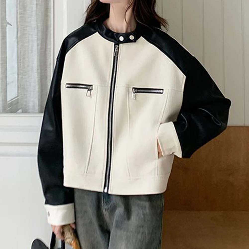 Cappotto con giunture in colore a contrasto in pelle PU bianca da donna primavera e autunno 2025 nuova piccola giacca corta da strada fritta retrò allentata