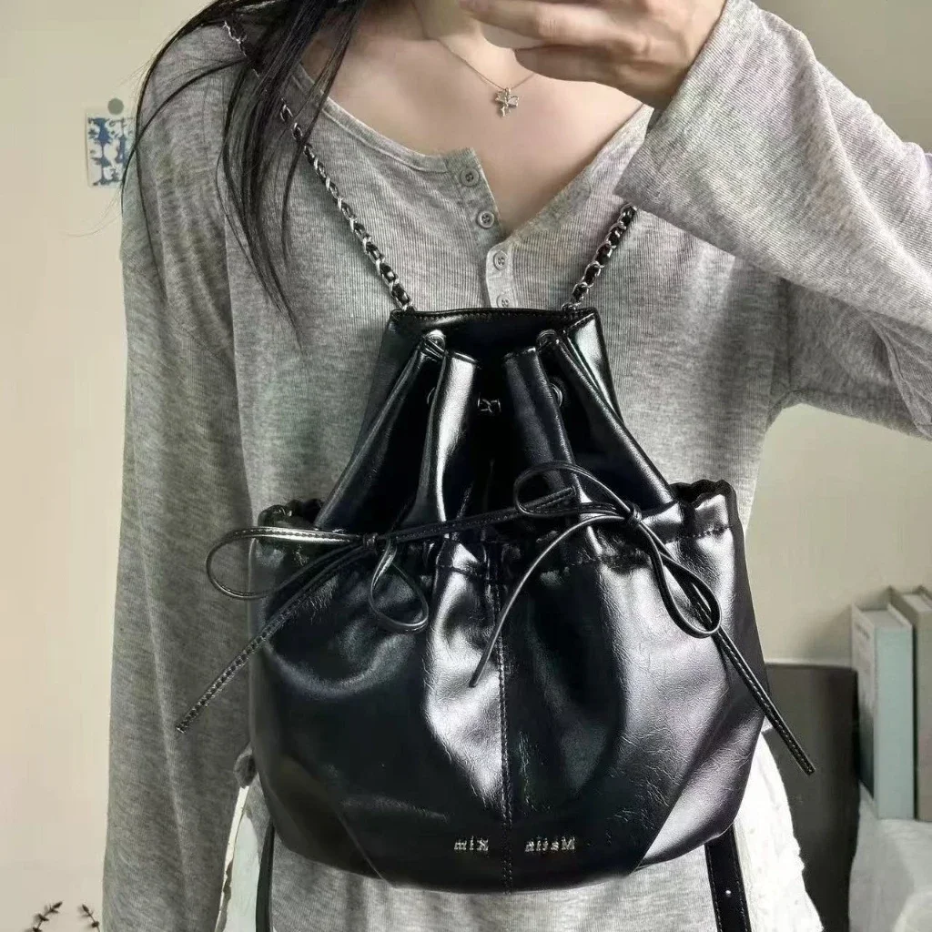 MATIN KIM Drawstring Bucket Backpack Women Ribbon Bowknot Chain Strap Soft PU Leather Shoulder Bag Korean Y2K Travel Daypack
