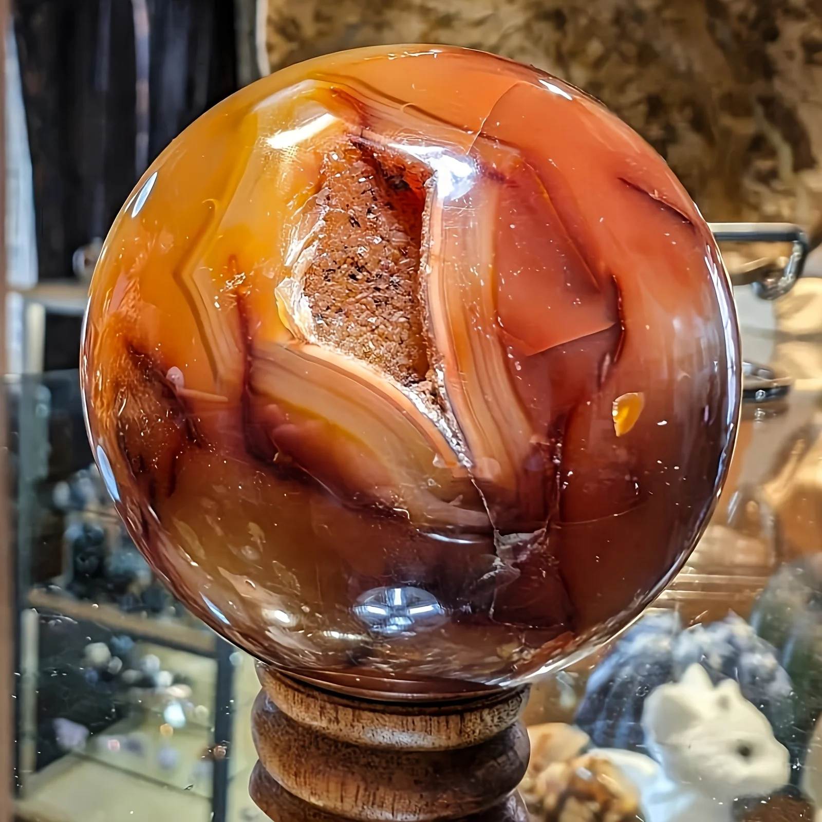 A Red Agate Sphere in Bohemian Style - This Polished Quartz Crystal Ball Features a Smooth Surface