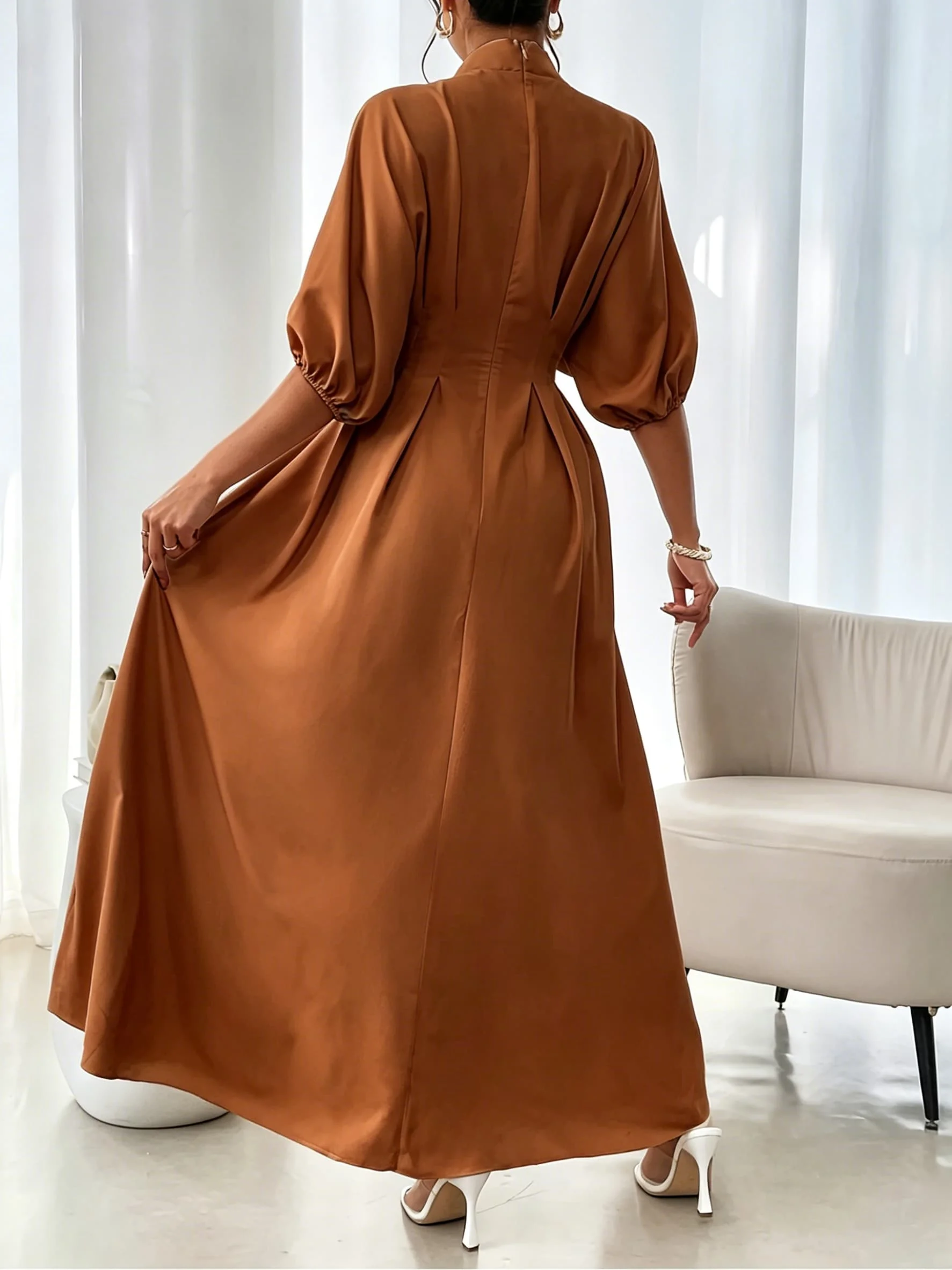 Women's caramel-colored stand-collar long dress with batwing lantern sleeves, pleated waist, A-line skirt, and elegant conservative robe
