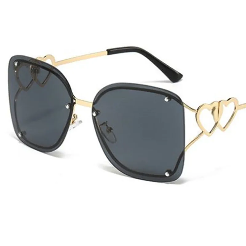 

Fashion Sunglasses Women Sun Glasses Rimless Anti-UV Spectacles Alloy Eyeglasses Double Heart Design Temples Ornamental