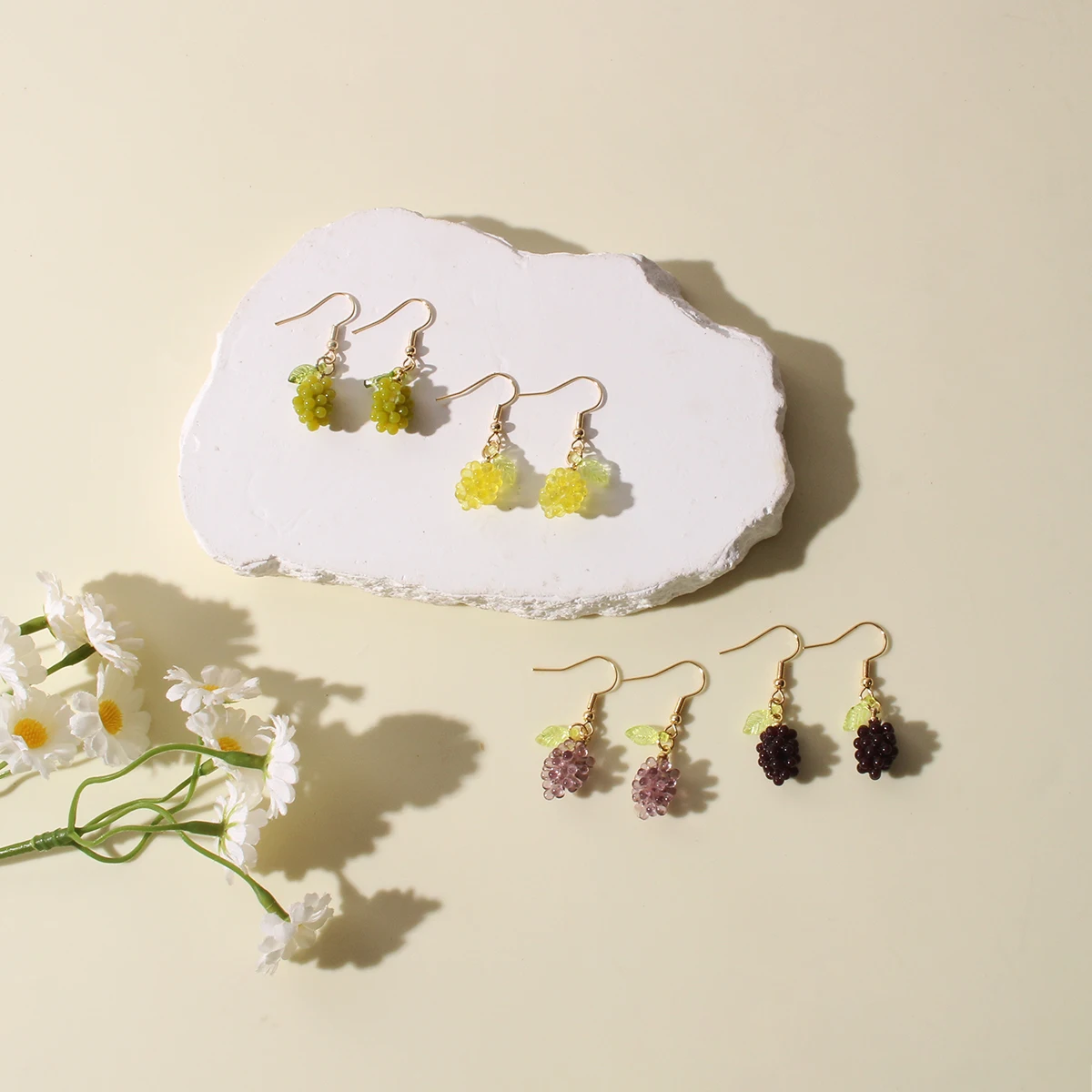 A pair of fresh and transparent faux fruit and grape resin earrings with a sweet and cute design are suitable for daily wear