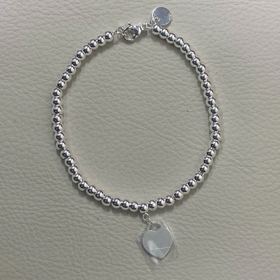 

The 2025 new T brand women's heart-shaped heart-shaped bracelet with round beads is a simple and elegant gift for your best frie