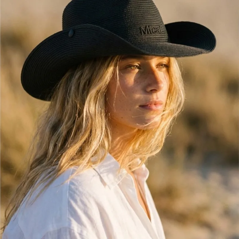 Female black wide-brimmed top hat style outdoor sunshade and