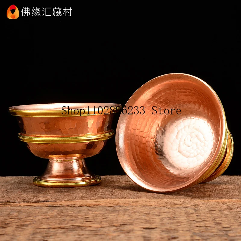A set of Indian copper water bowls with high legs, used for offering water to Buddha7A holy water cup for offering at the Buddh