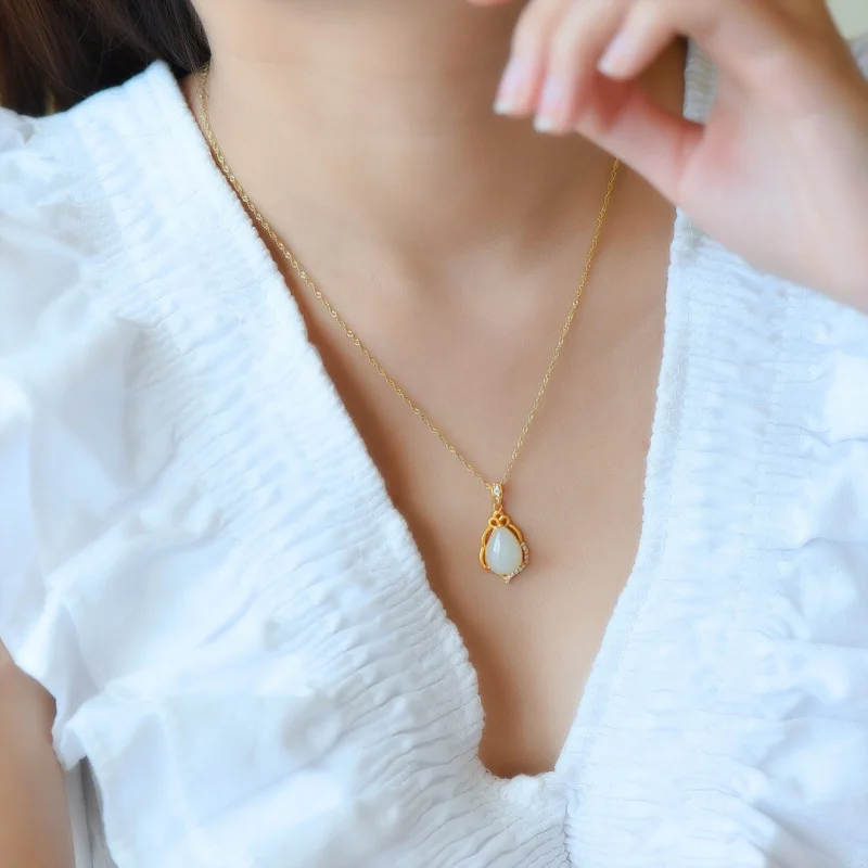 

Silver Inlay Hotian Jade Pendant