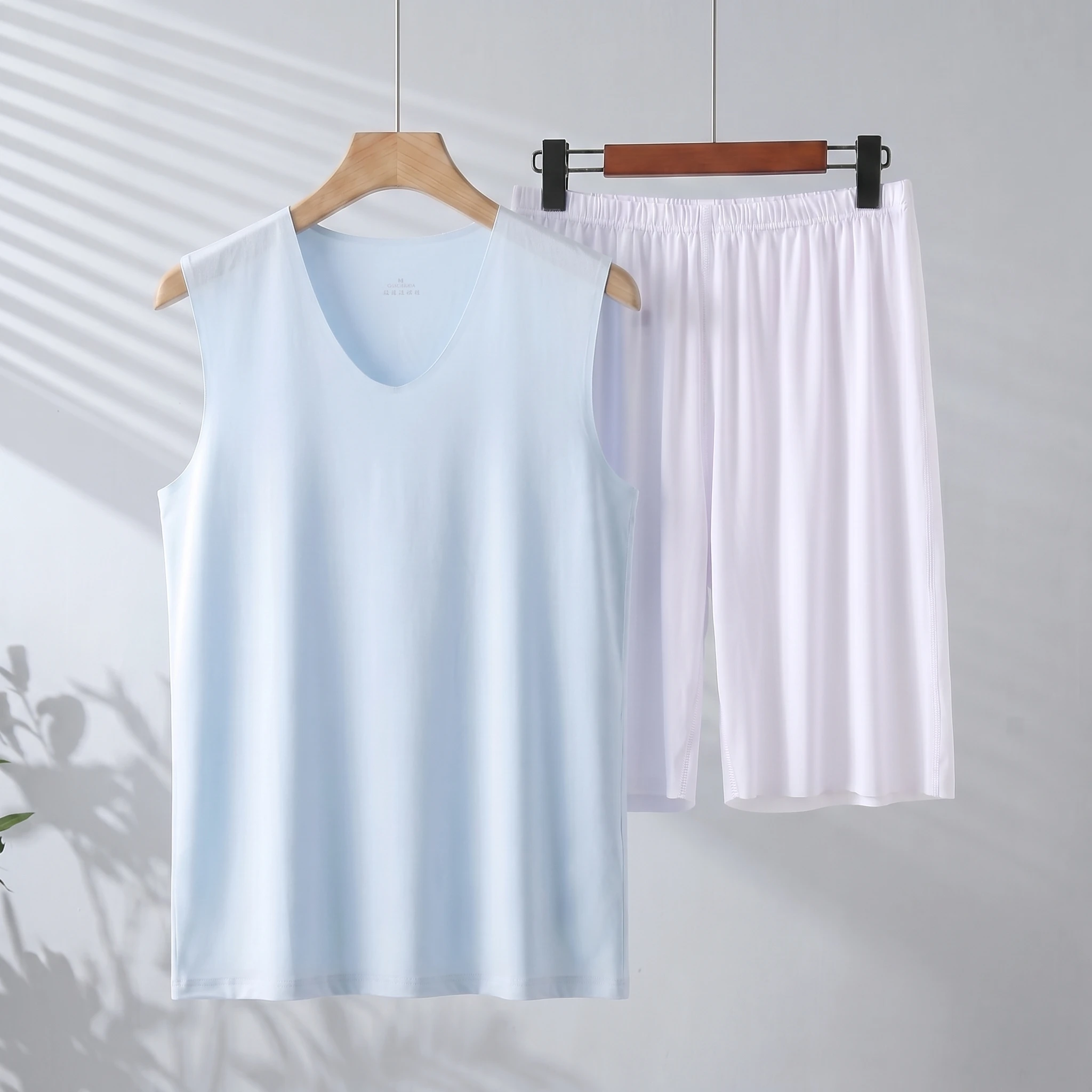 Light blue vest + white shorts