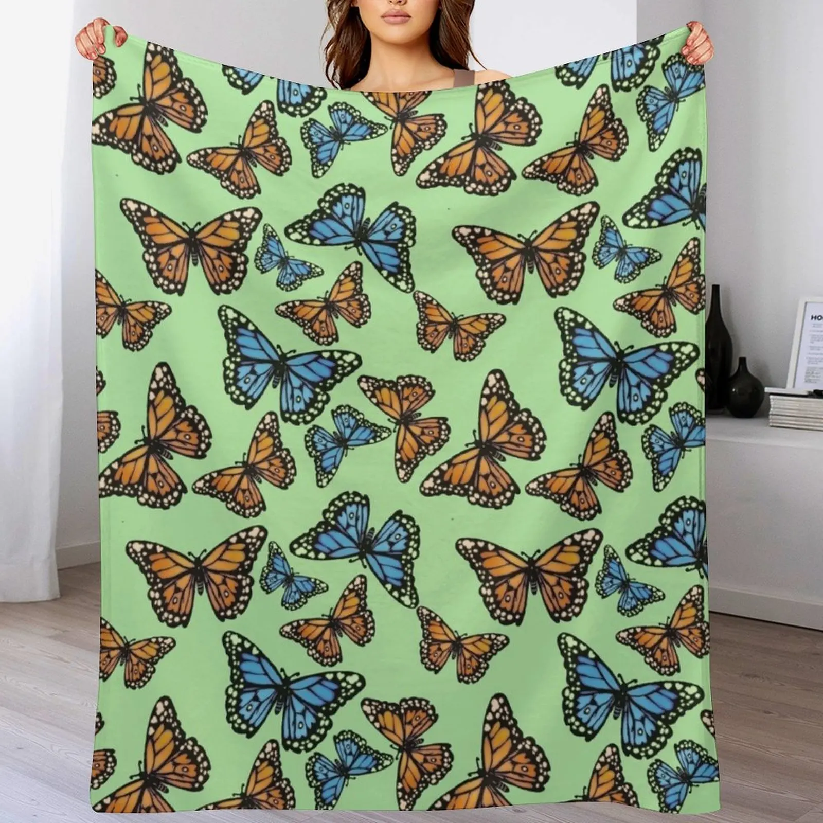 Blue and Orange Monarchs on Pastel Green Throw Blanket