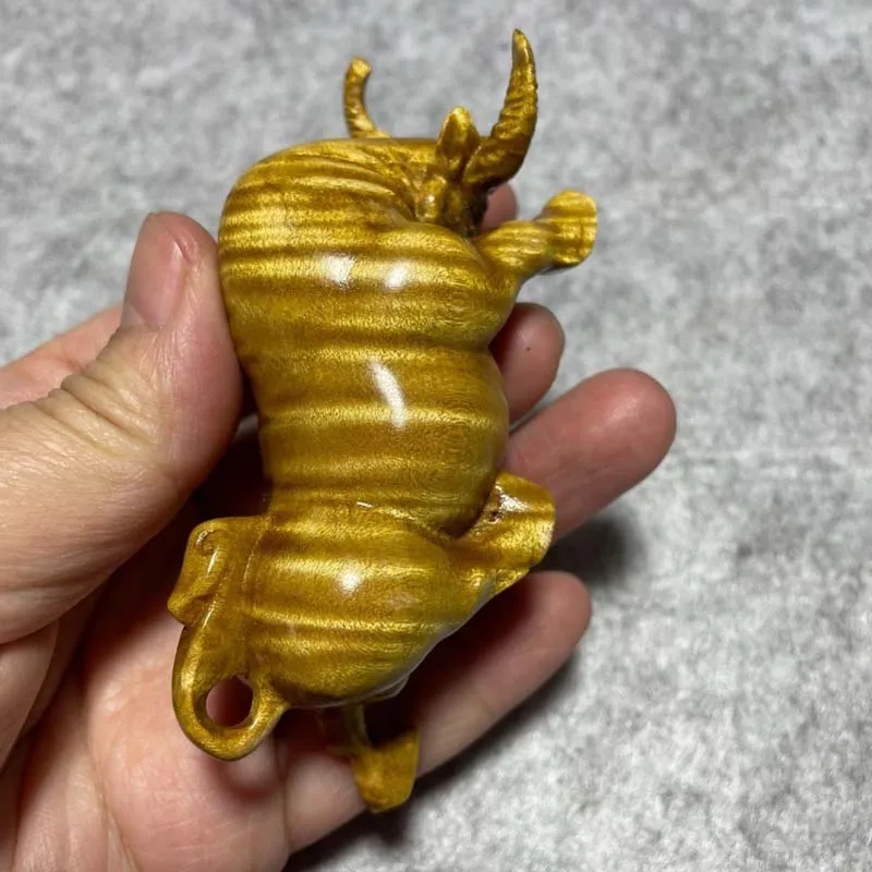 Hand‑Carved Fighting Bull Hand Piece Golden Nanmu Wood Stunning Water‑Ripple Grain Zodiac Ox 