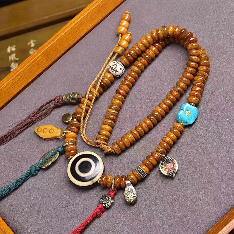 Tibetan-style cultural artifact: 108-bead Buddhist prayer bone beads, agate, and turquoise, with a hanging neck chain