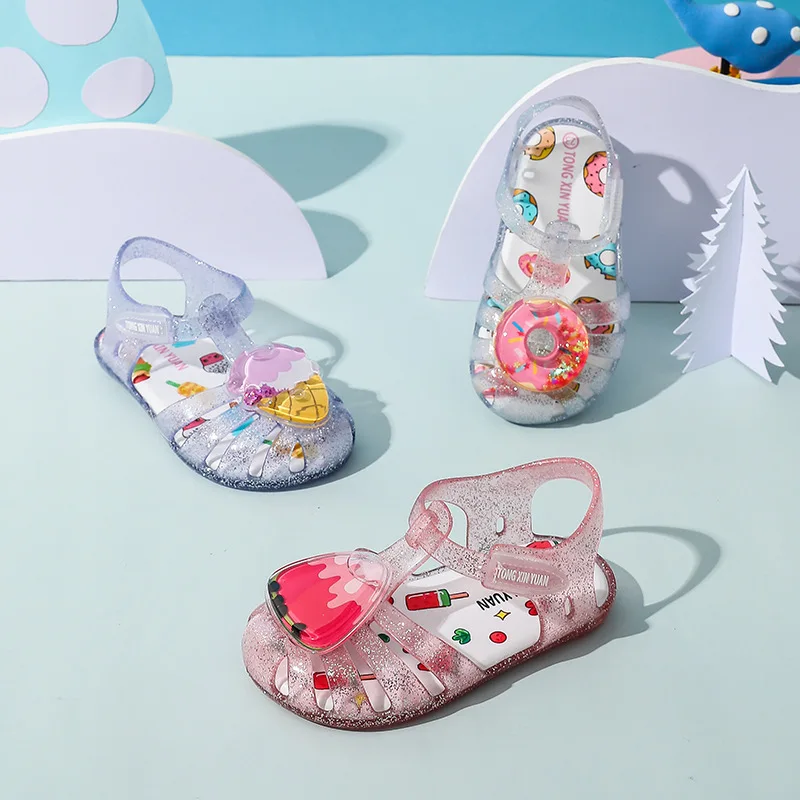 Sandali per ragazze estate principessa 2024 nuovi bambini gelato anguria ciambella scarpe da spiaggia Baby Baotou Jelly Shoes scarpe di cristallo