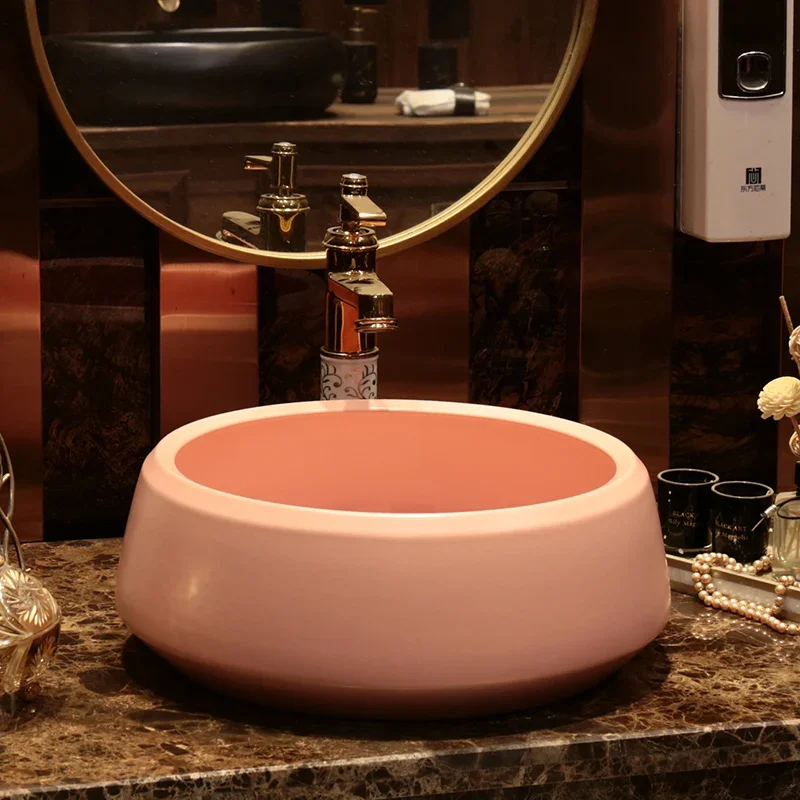 

Solid color simple countertop wash basin, pink modern wash basin, round heightened balcony wash basin