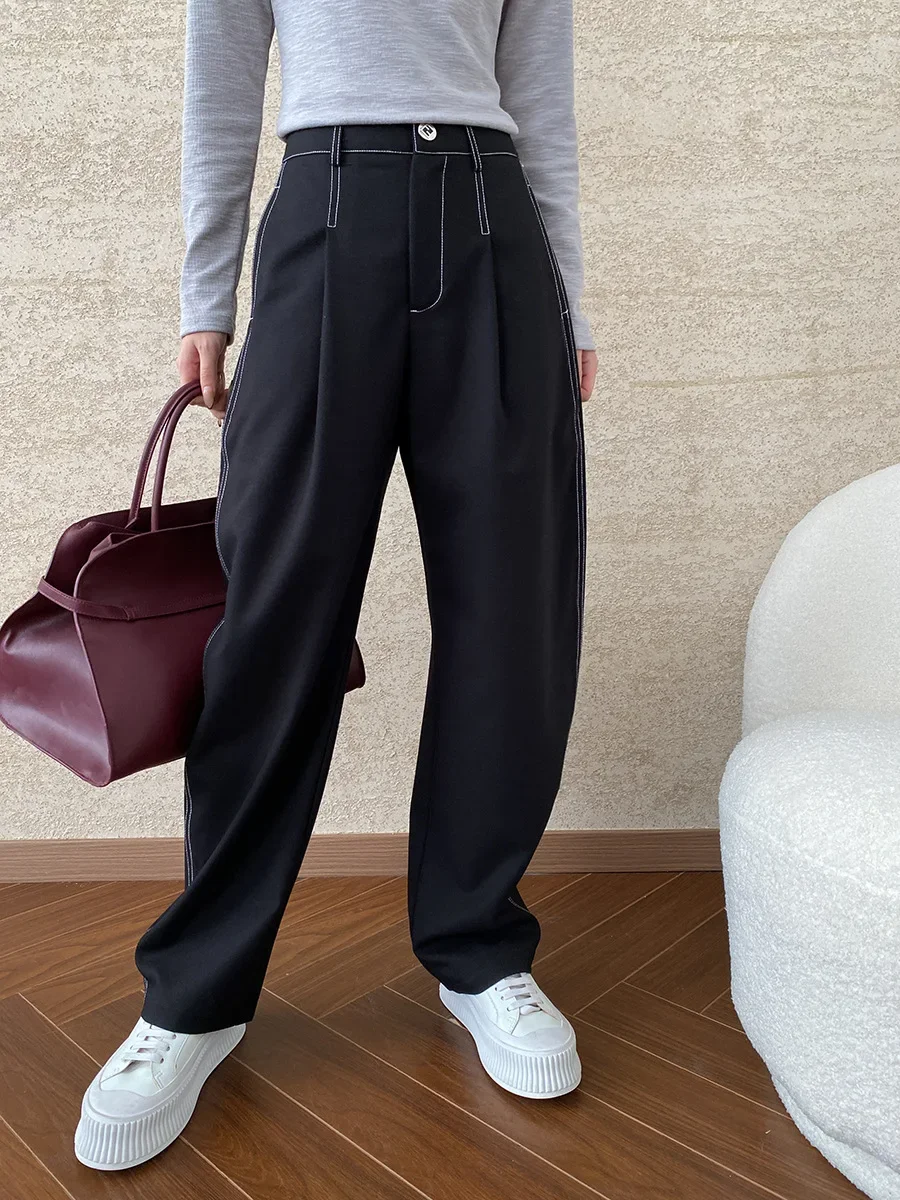 Deconstructed, split exposed outer seams, straight, loose, drapey casual pants with a yuppie vibe.