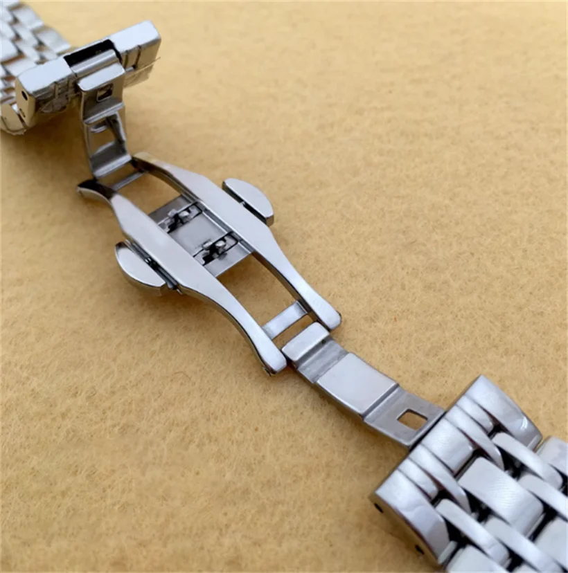 อุปกรณ์เสริมนาฬิกาสำหรับผู้ชายผู้หญิงสแตนเลสสตีลความแม่นยำสูงแถบเหล็ก20มม. สร้อยข้อมือหัวเข็มขัดผีเสื้อโลหะ