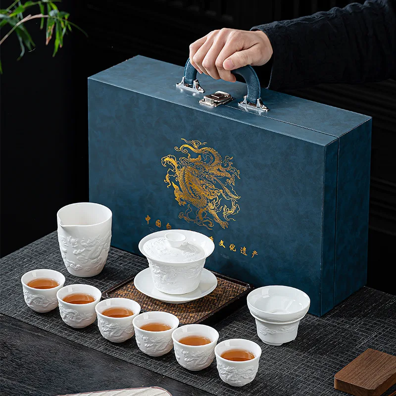Dehua White Porcelain Lambswool Jade Embossed Dragon and Phoenix Gaiwan Tea Set Kung Fu Tea Set with 6 Cups Business Gifts
