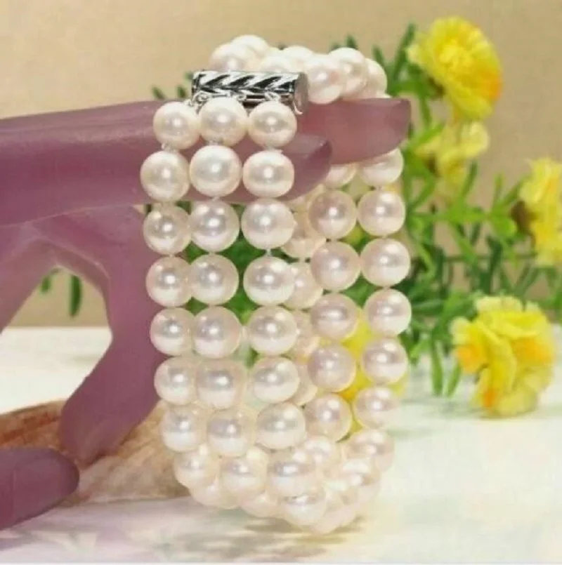 bracciale-con-3-file-di-perle-bianche-naturali-rotonde-del-mare-del-sud-10-9-mm-in-oro-bianco-14-carati