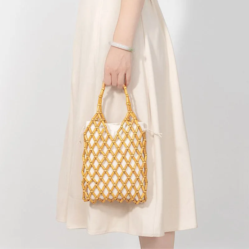 

Fashion summer women bohemian hand-woven handmade tote bag beautiful niche design hollow wood bead mesh canvas beach commuter ba