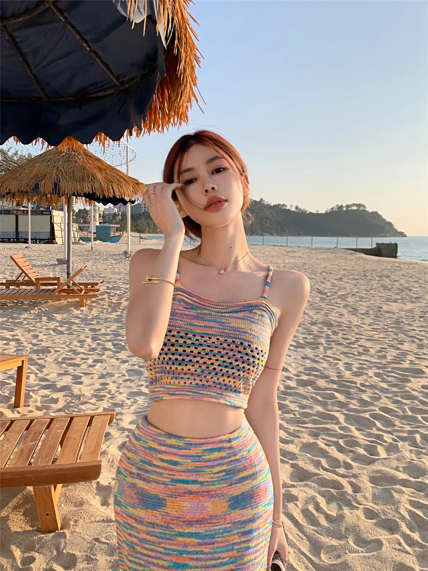 

Summer new hot girl rainbow yarn hollow knitted off-shoulder suspender suit female pure desire slimming skirt two-piece set