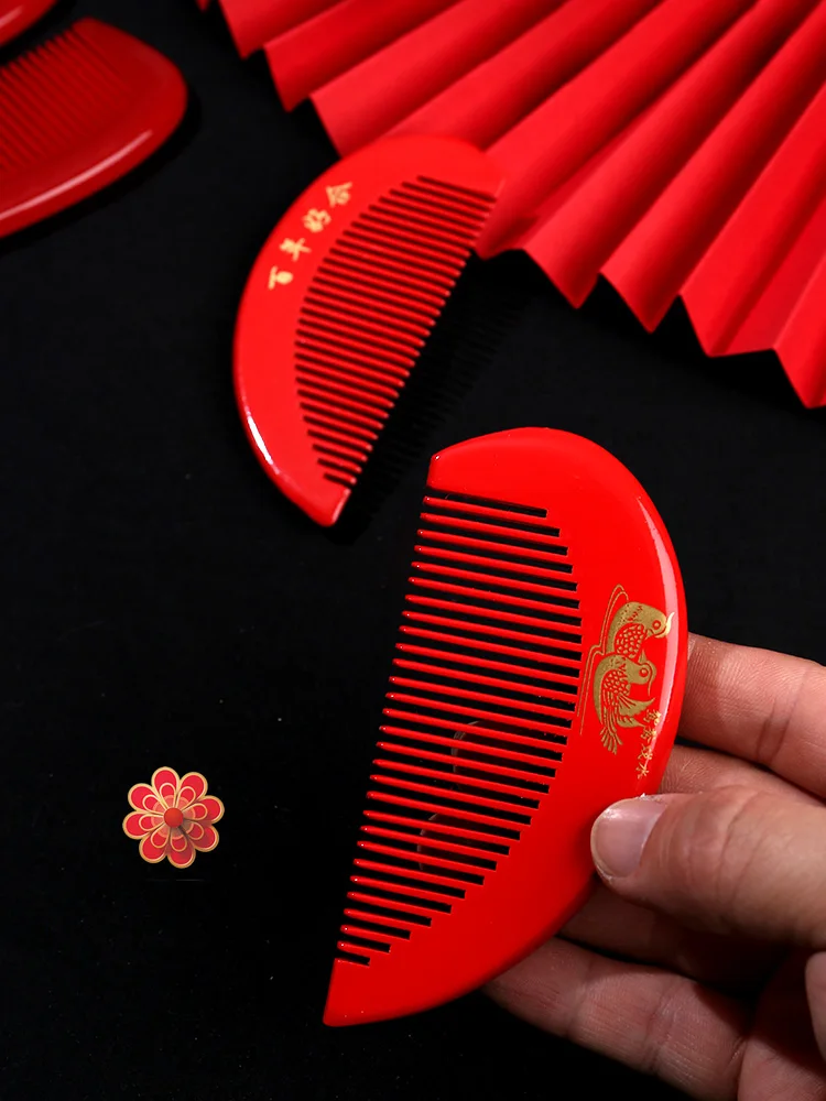 Wedding comb, wooden comb, a pair of red dowry items