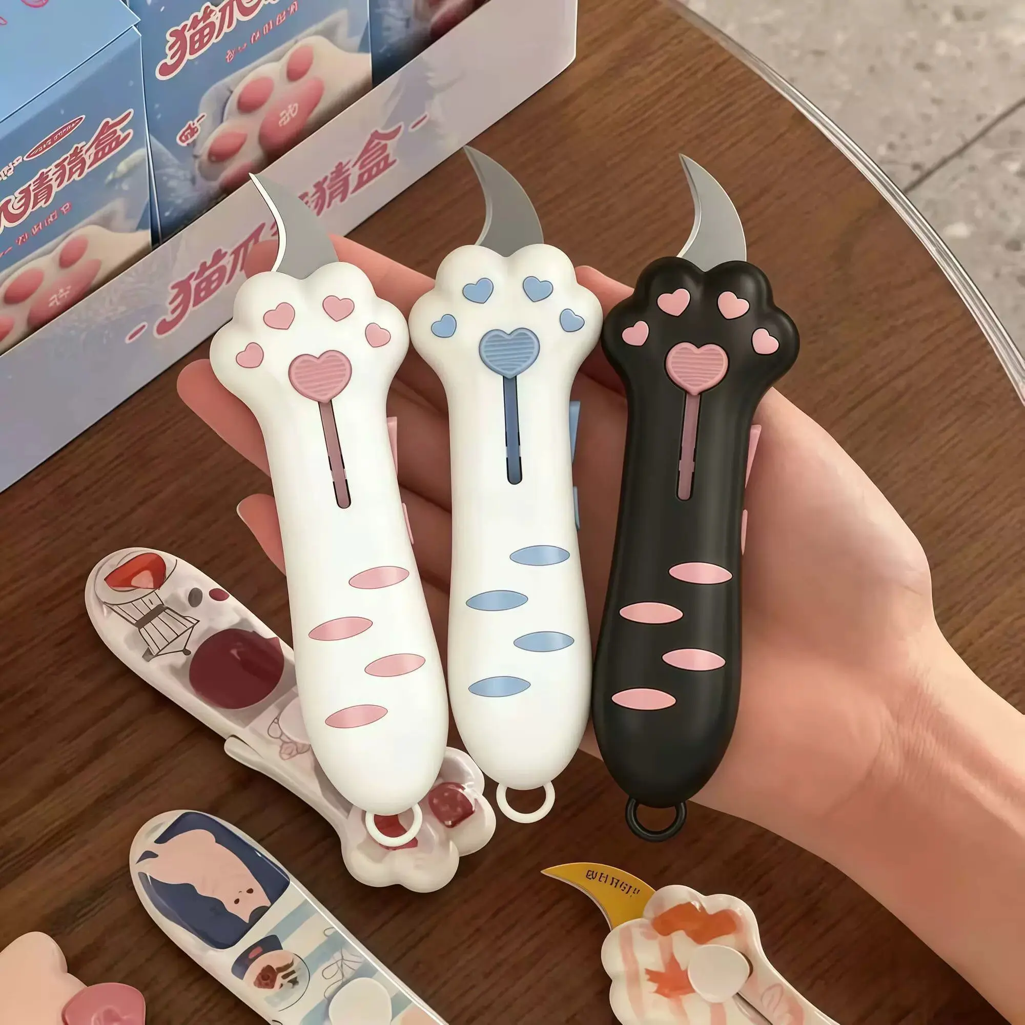 material-escolar-para-escritorio-ferramenta-de-corte-de-papel-abridor-de-caixas-retratil-cortador-de-caixas-de-plastico-fofo-em-formato-de-garra-de-gato-desenho-animado