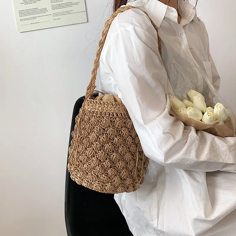 Straw Woven Bag 2022 New Bag Women's Beach Vacation Woven Bucket Bag Hollow Net Red Shoulder Messenger Bag Wholesale