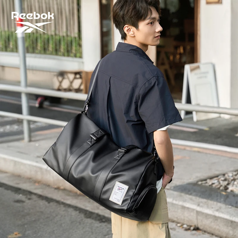 borsa-da-viaggio-reebok-in-pelle-nera-di-grande-capacita-per-uomo-e-donna-con-scomparto-per-scarpe-asciutte-ideale-per-palestra-e-weekend