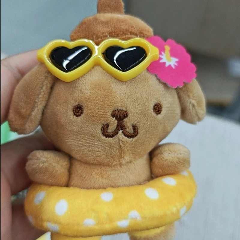 Zwart lederen zwemringen Pudding Hond Poppen Leuke cartoonanimatie Perifere knuffels Rugzakken Pluche hangers Meisjescadeau