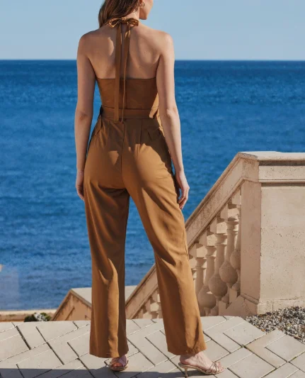 Nieuwe modieuze en hoogwaardige minimalistische mouwloze damesjumpsuit met slanke pasvorm en afslankende tailleriem en jumpsuit met wijde pijpen