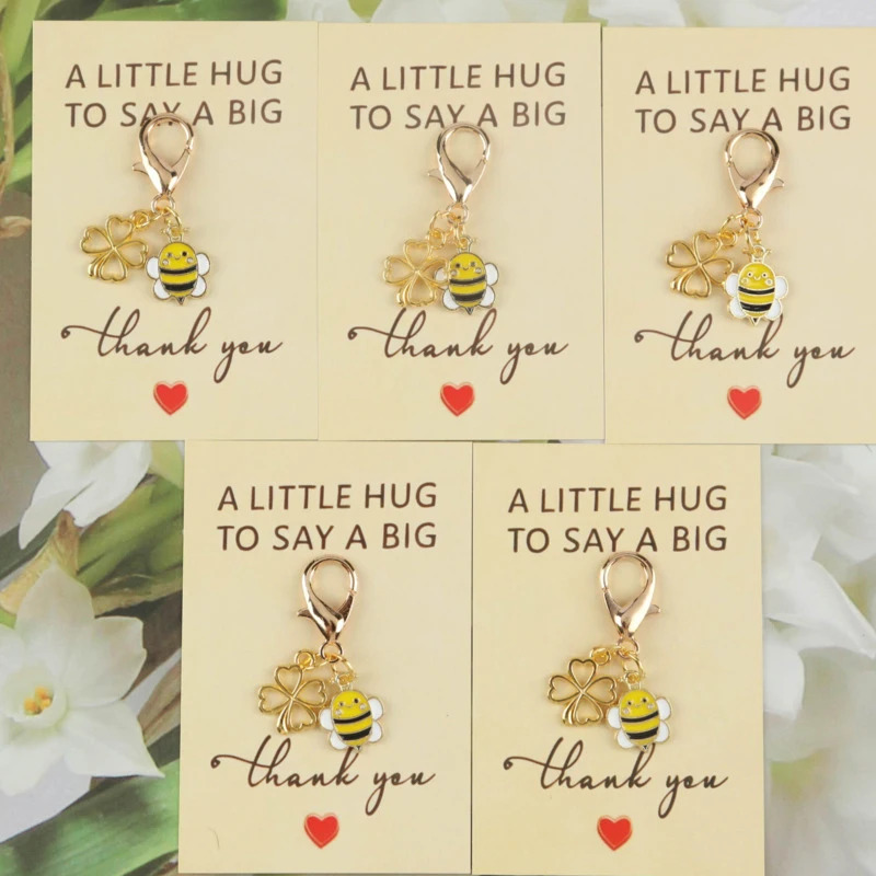 5/10pcs 2dCute little bee paired with four-leaf clover series keychain set Comes with a small greeting card with a big thank you
