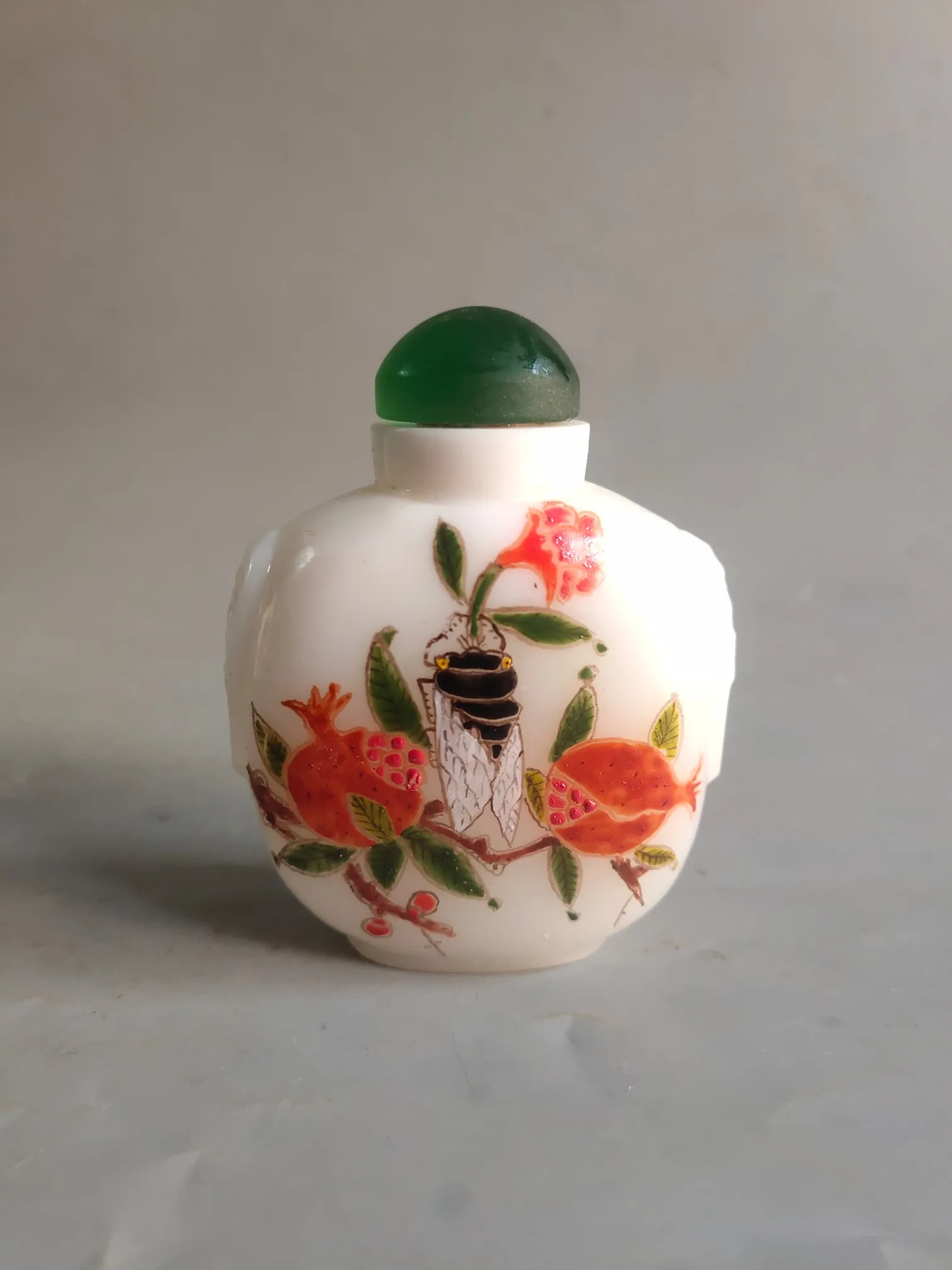 A selection of old Chinese colored glass bottles decorated with small ornaments