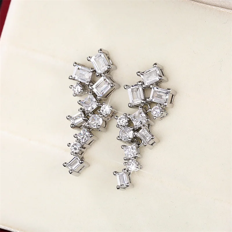 Huitan trend ige geometrische cz Tropfen Ohrringe für Frauen Silber Farbe Temperament Dame Ohr Accessoires Hochzeit Aussage Schmuck
