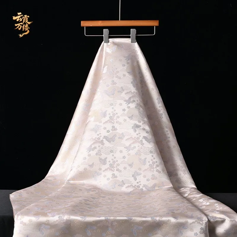 The elegant golden thread and glow imitation brocade jacquard fabric is a grand for cheongsam Hanfu clothing