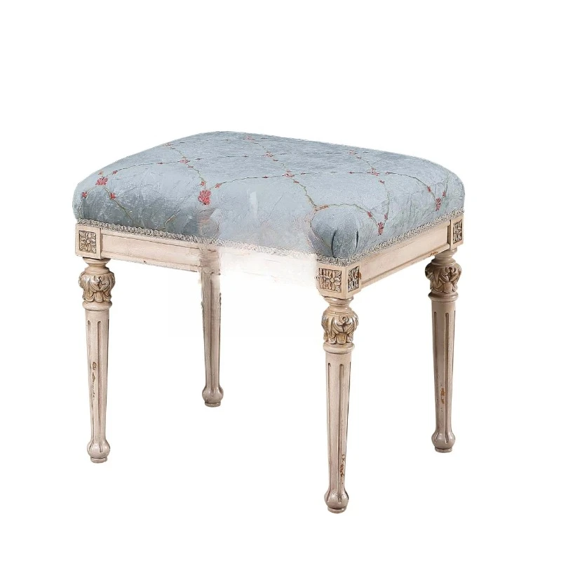 Antique American dresser stool with blue quilted upholstery, faux cream finish, grooved carved legs