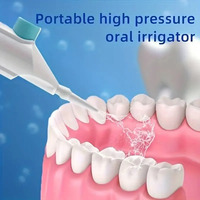 Portable high-pressure oral irrigator - manual tooth cleaner with grip, nozzle attachment for gum health