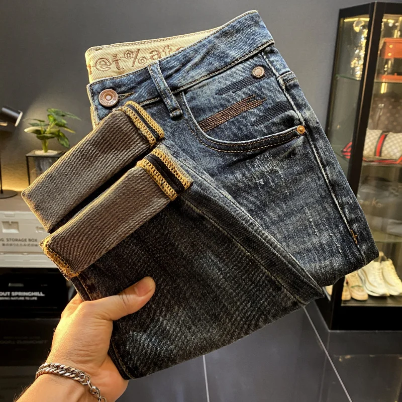 กางเกงยีนส์ทรงเกวงขาสั้นเก้าส่วนสไตล์อเมริกันสุดหรูสำหรับผู้ชาย รุ่นใหม่สุดเทรนด์ ทรงเข้ารูปสวยงาม สวมใส่สบายๆ