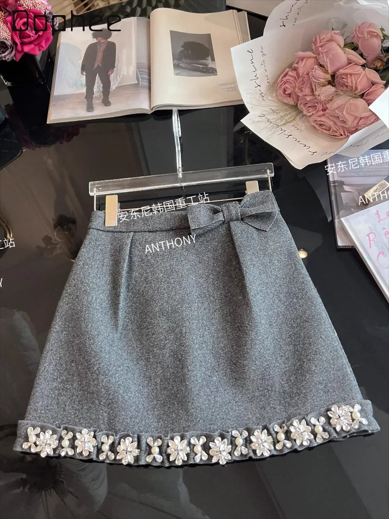 

2025 Autumn Winter New Luxury Heavy Beaded Rhinestone Bow Woolen Skirts High Waist Slimming Elegant Socialite A-line Skirt Women