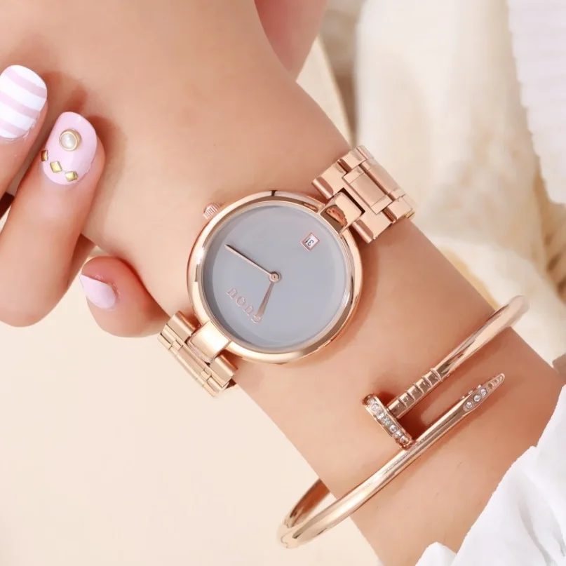 

New Stylish And Classic QuartzWatch With A Large Dial And Stainless Steel Band; Features A Date DisplayA Simple Design For Women