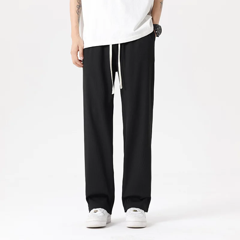 

New Spring and Summer Ice Silk Casual Pants Men's Fashion Brand Thin Sports Pants Black Loose Tying Feet Nine-point Trousers