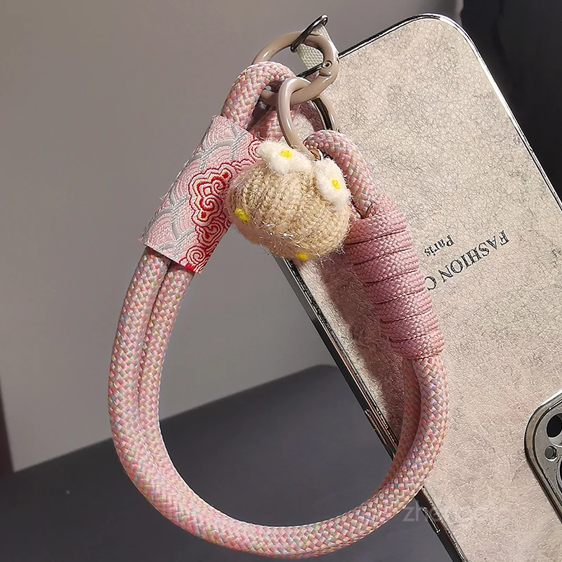 

Новый тканый ремешок на запястье для мобильных телефонов, короткий для путешествий на открытом воздухе, портативный и подвесной с защитой от падения, новый продукт