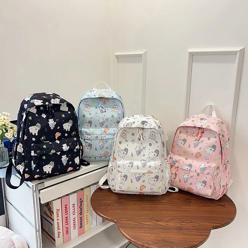 กระเป๋าเป้สะพายหลัง Hello Kitty รุ่นใหม่ปี 2025 พร้อมโบว์ลายการ์ตูนอนิเมะ สำหรับนักเรียน กระเป๋านักเรียน กระเป๋าหนังสือ กระเป๋าเดินทาง กระเป๋าเป้กลางแจ้ง ของขวัญสำหรับเด็ก