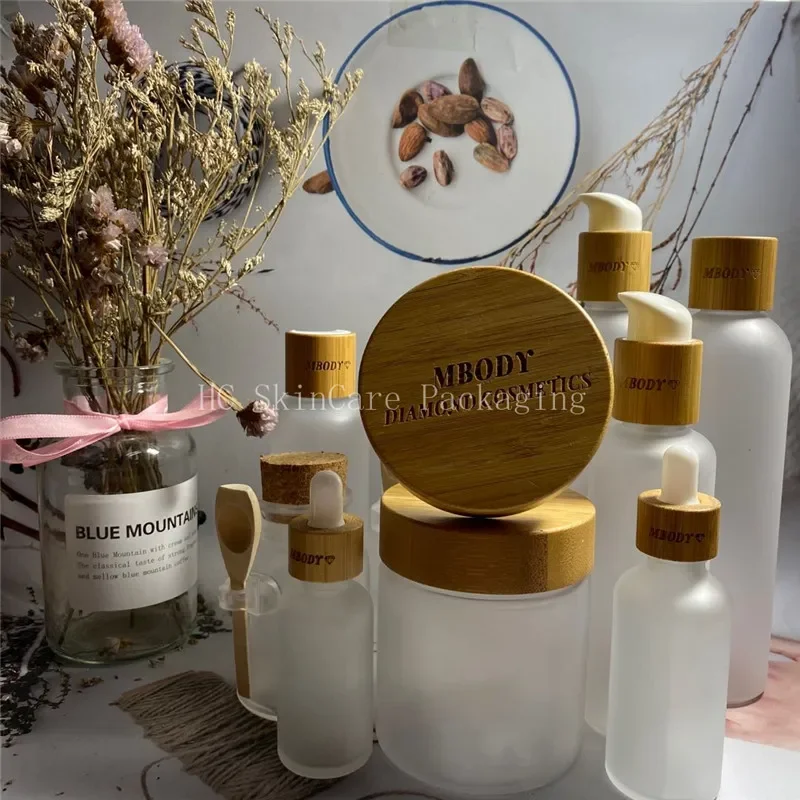 

Hot Sale empty Frosted Plastic Bottles With Bamboo Cap Lotion Bottles Screw Cap and Plastic Cream Jar Cosmetic Packaging bottles