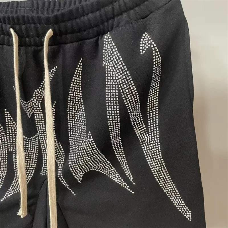 2025 ملابس الشارع الأمريكية مختلطة العاطفة الرجال السراويل الساخن الماس إلكتروني طباعة النساء السراويل السوداء #3