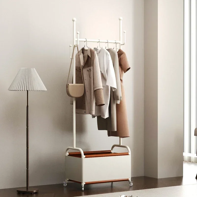 A  Simple small apartment household bedside bedside tail coat rack wrought iron cream wind removable hanger clothes storage rack
