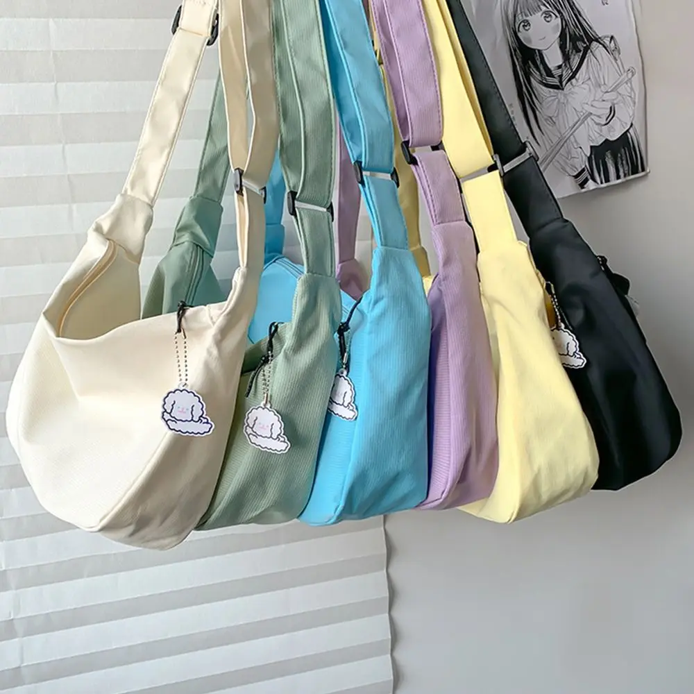 Large Capacity Lightweight Shoulder Bag Solid Color Cream Color Canvas Bag with Pendant Messenger Bag Handbag