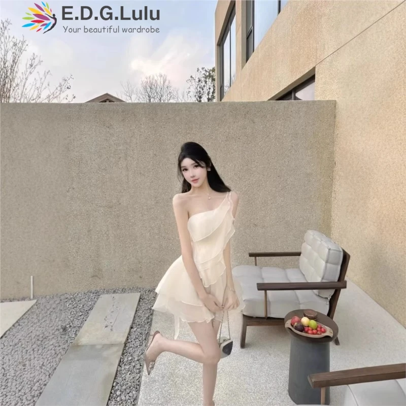 

EDGLuLu Asymmetrical Collar One Shoulder Dress Woman Design Irregular Stacked Ruffled White Dress Beach Vacation 0309