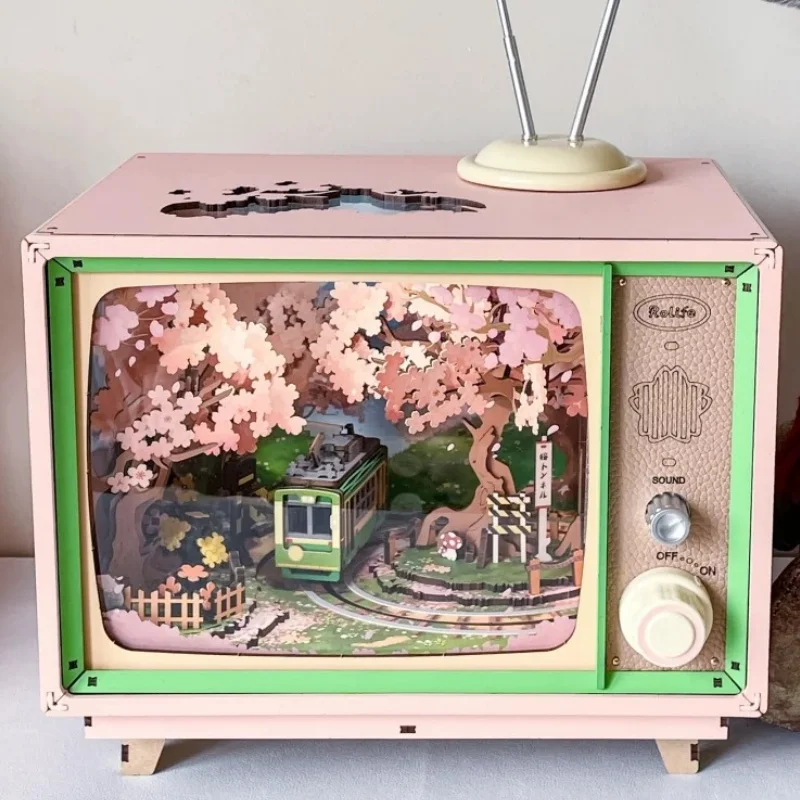 Robotime Rolife لتقوم بها بنفسك صندوق تشغيل الموسيقى ساكورا حالمة جولة ثلاثية الأبعاد لغز خشبي كتاب الزاوية التلفزيون أطقم منمذجة ديكور المنزل هدية عيد ميلاد عيد الميلاد