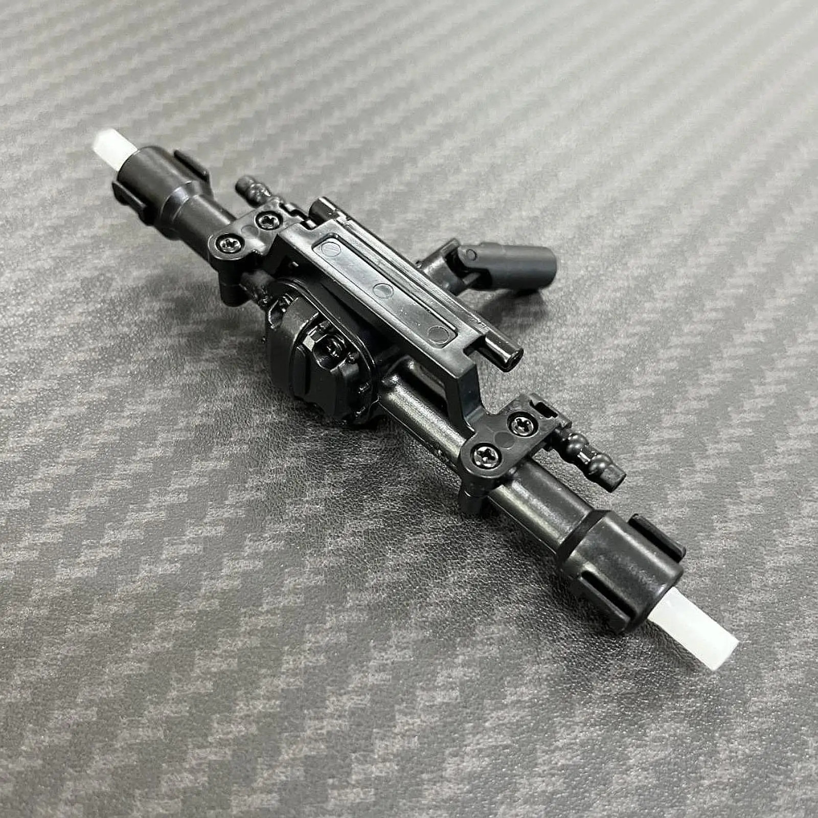 L'asse posteriore RC sostituisce la parte di aggiornamento delle parti per i veicoli per auto RC MN82 MN78 1/12