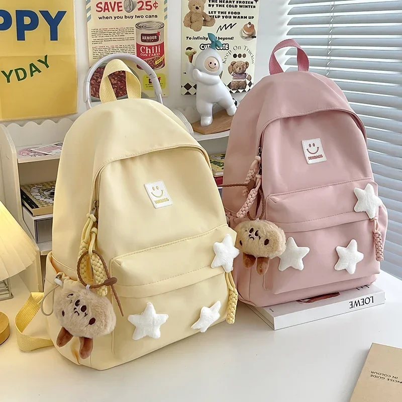 Yao Dong Cute Pink Backpack for Girls Fashionable Star Decorated School Bag with Plush Charm Ideal for Daily Use and School Cute