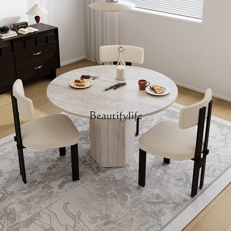 

travertine rock slab dining table in the ancient small apartment round table